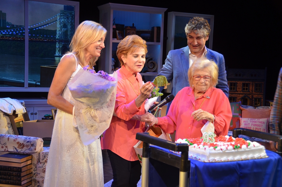 people standing over cake