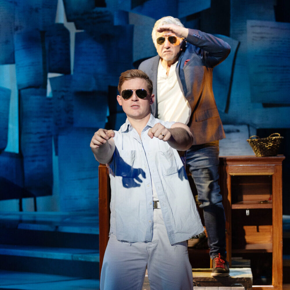 two men performing on stage