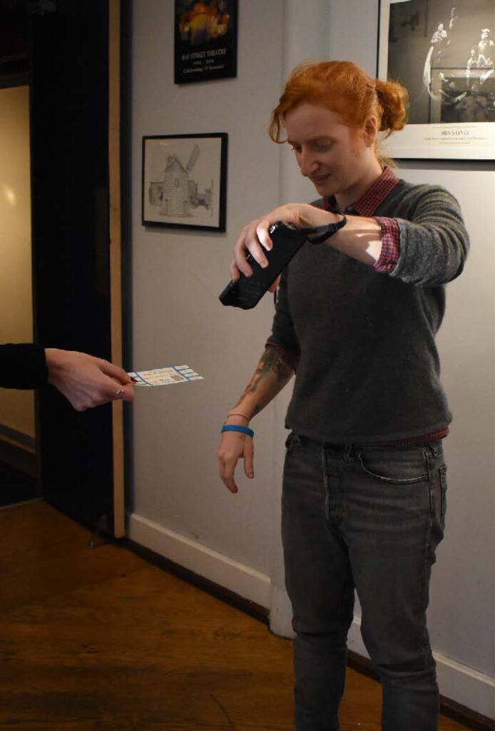 woman scanning tickets