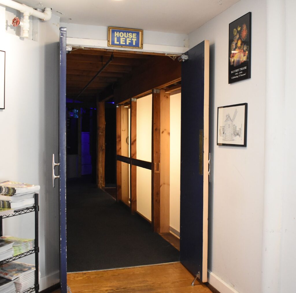 entrance to house left of the theater