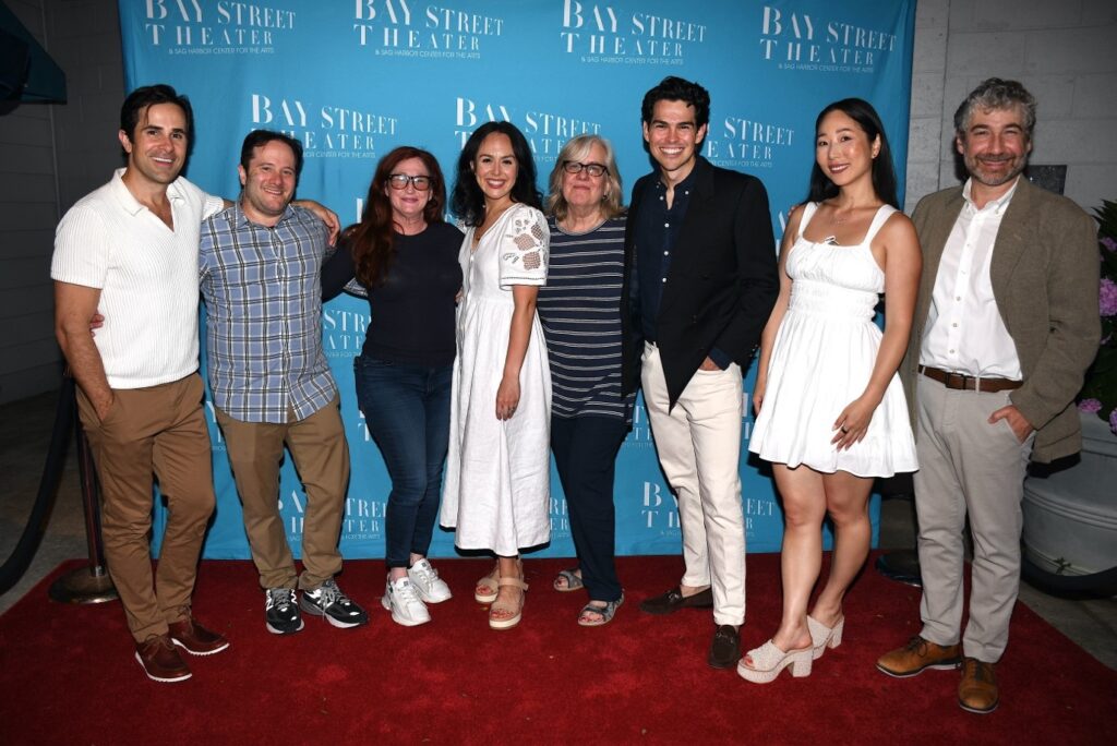 group photo in front of bay street theater sign on red carpet